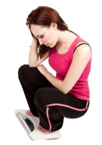 woman on weighing scale 
